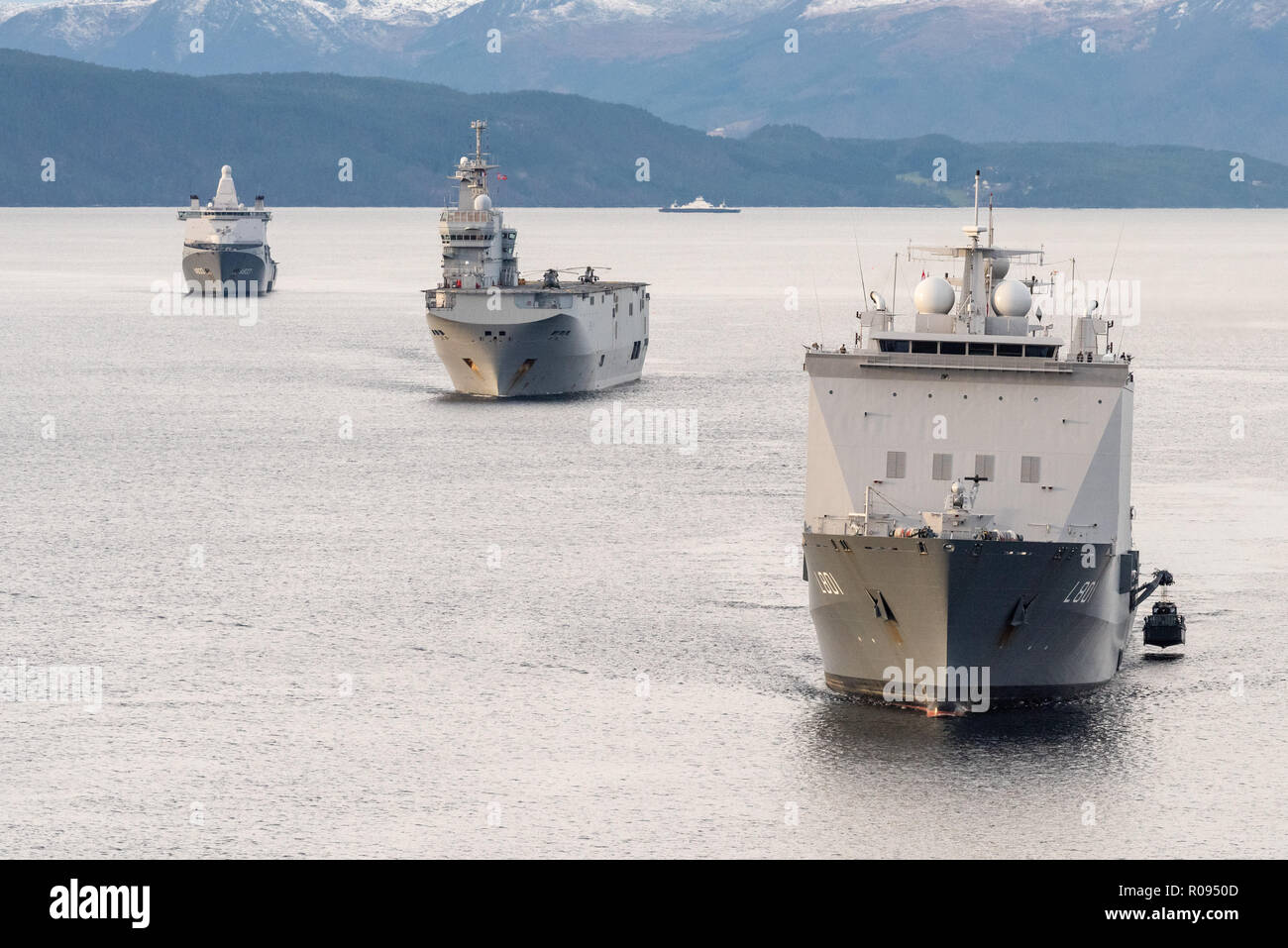 NORWAY, Nov. 1.  2018. GEN. SNMG2 VESSELS ESCORT AMPHIBIOUS TASK GROUP   HNLMS Johan de Witt , HNLMS Karel Doorman, and FS Dixmude in the Molde Fjords to conduct Amphibious Assault.  Trident Juncture 18 is designed to ensure that NATO forces are trained, able to operate together and ready to respond to any threat from any direction. Trident Juncture 18 takes place in Norway and the surrounding areas of the North Atlantic and the Baltic Sea, including Iceland and the airspace of Finland and Sweden.     With around 50,000 participants from 31 nations Trident Juncture 2018 is one of NATO’s larges Stock Photo