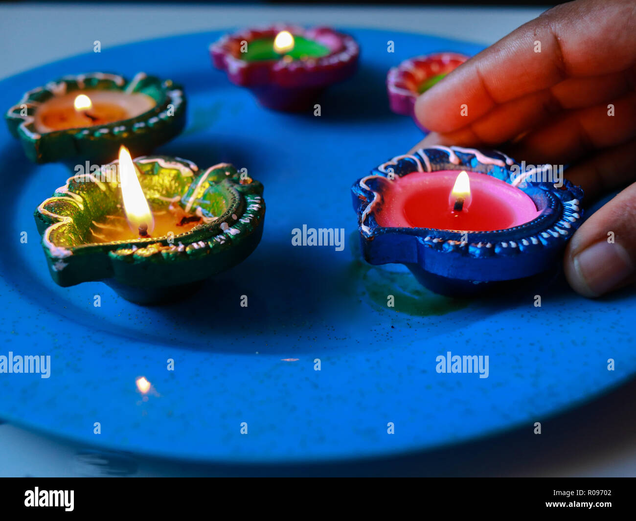 5 colourful diyas arranged in plate hires stock photography and images