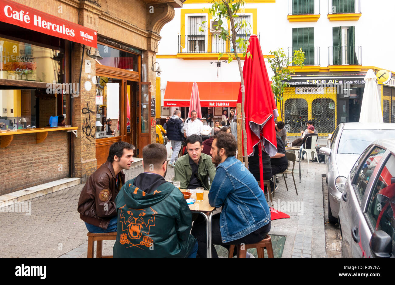 Four male friends at the Cafe Hercules in Seville, Spain Stock Photo