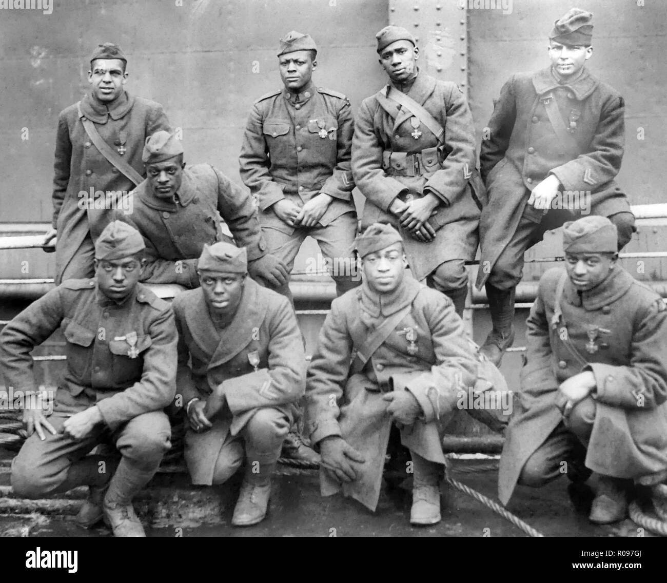 FIRST WORLD WAR. A few of the soldiers from the 369th (15th N>Y>) regiment who received the French Croix de Guerre for gallantry in action. L to r (front row) Privates .Ed Williams, Herbert Taylor, Leon Fraitor,Ralph Hawkins (back row) Sgt. H.D.Prinas, Sgt. Dan Storms, Pvt.Joe Williams, Pvt.Alfred Hanley,Cpl.T.W. Taylor. Taken aboard the USS Stockholm on 12 February 1919 while awaiting disembarkation in New York. The regiment were known as the Harlem Hellfighters.Photo: US National Archives Stock Photo