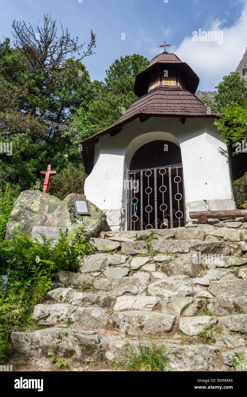 VYSOKE TATRY, SLOVAKIA - JULY 10, 2016: Small chapel in symbolic cemetery near Popradske lake in High Tatras in Slovakia during summer day. This is th Stock Photo