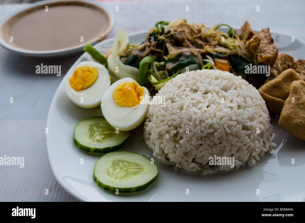 GADO GADO with rice, typical Indonesian salad with hardboiled eggs, boiled potato, fried tofu