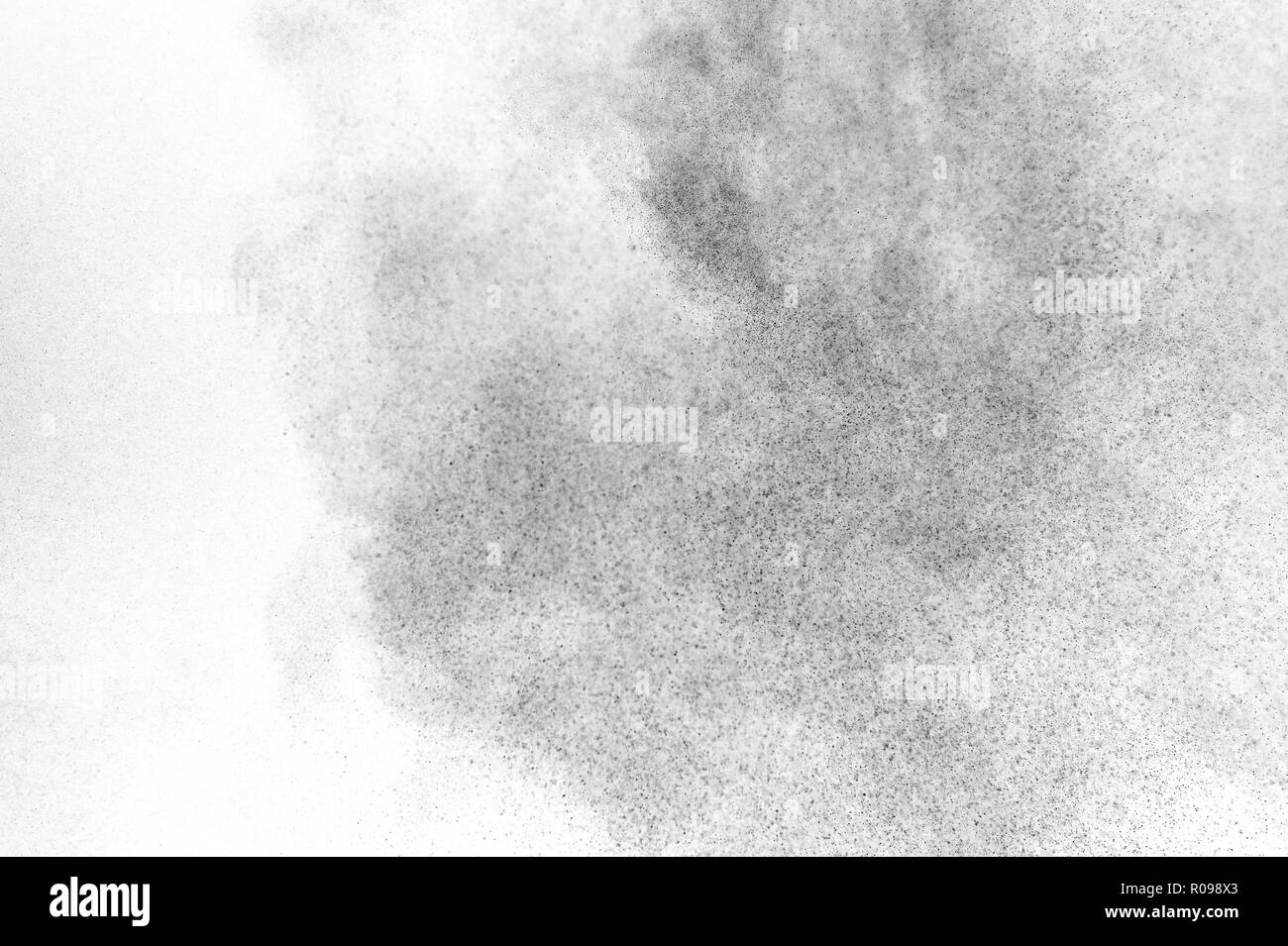 Black particles explosion isolated on white background. Abstract dust ...