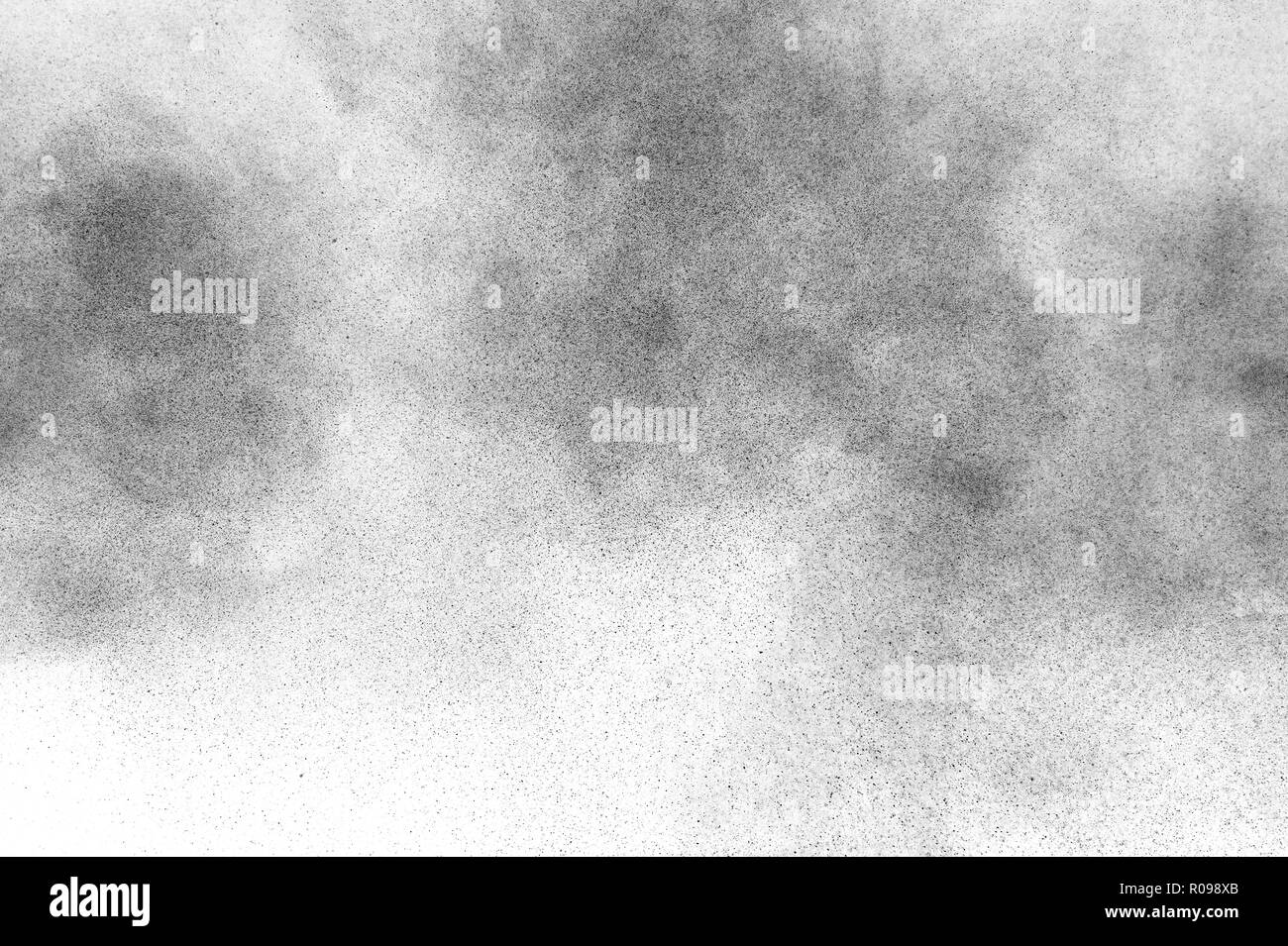Black particles explosion isolated on white background. Abstract dust ...