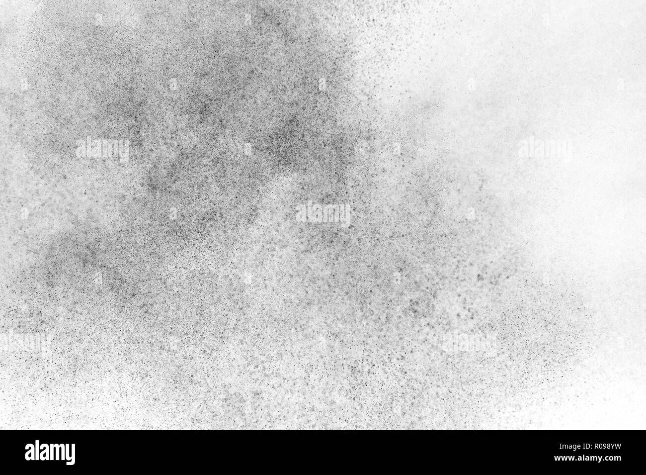 Black particles explosion isolated on white background. Abstract dust ...