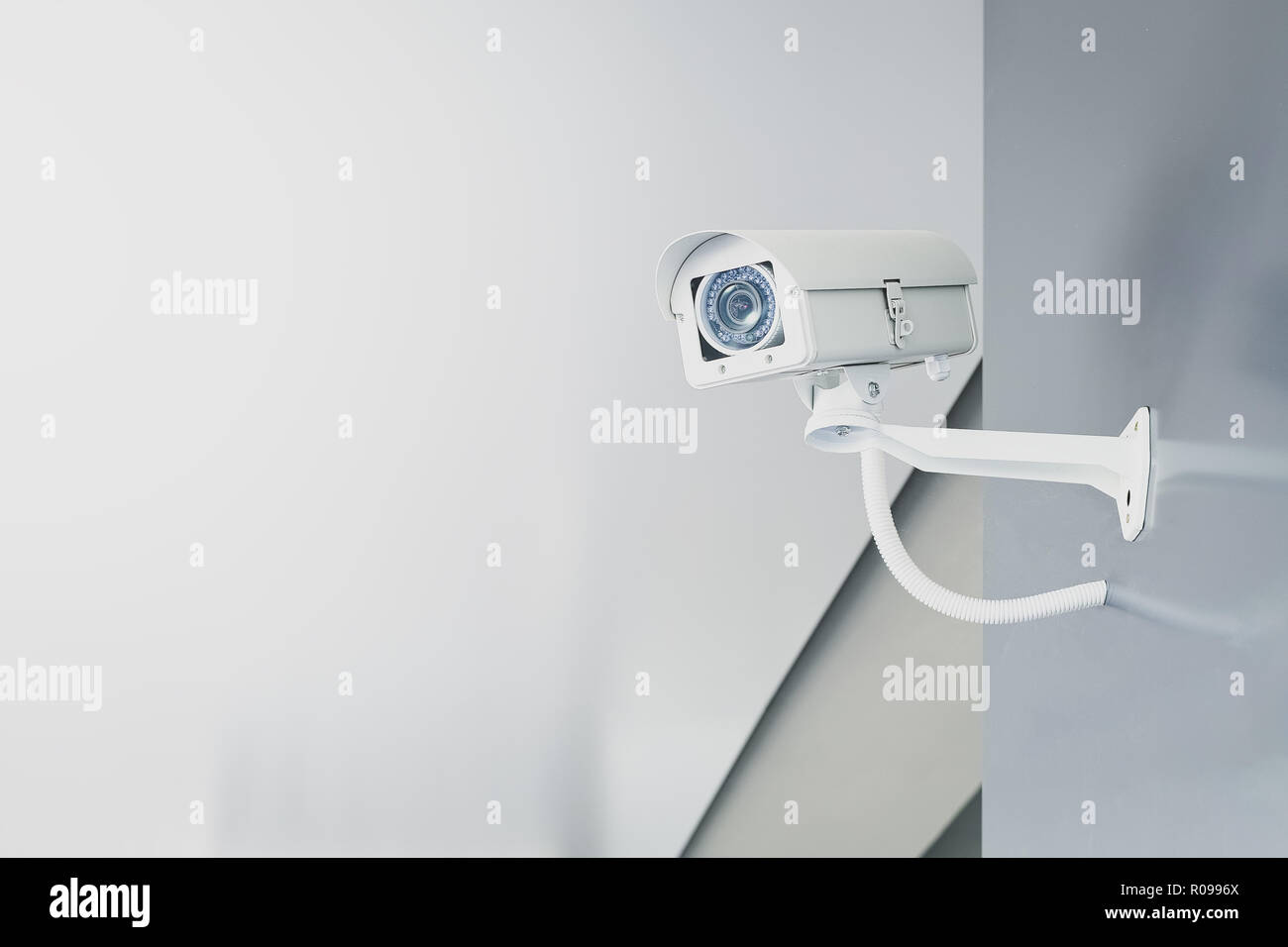 CCTV security camera on wall in the home office for surveillance monitoring home guard system. Stock Photo