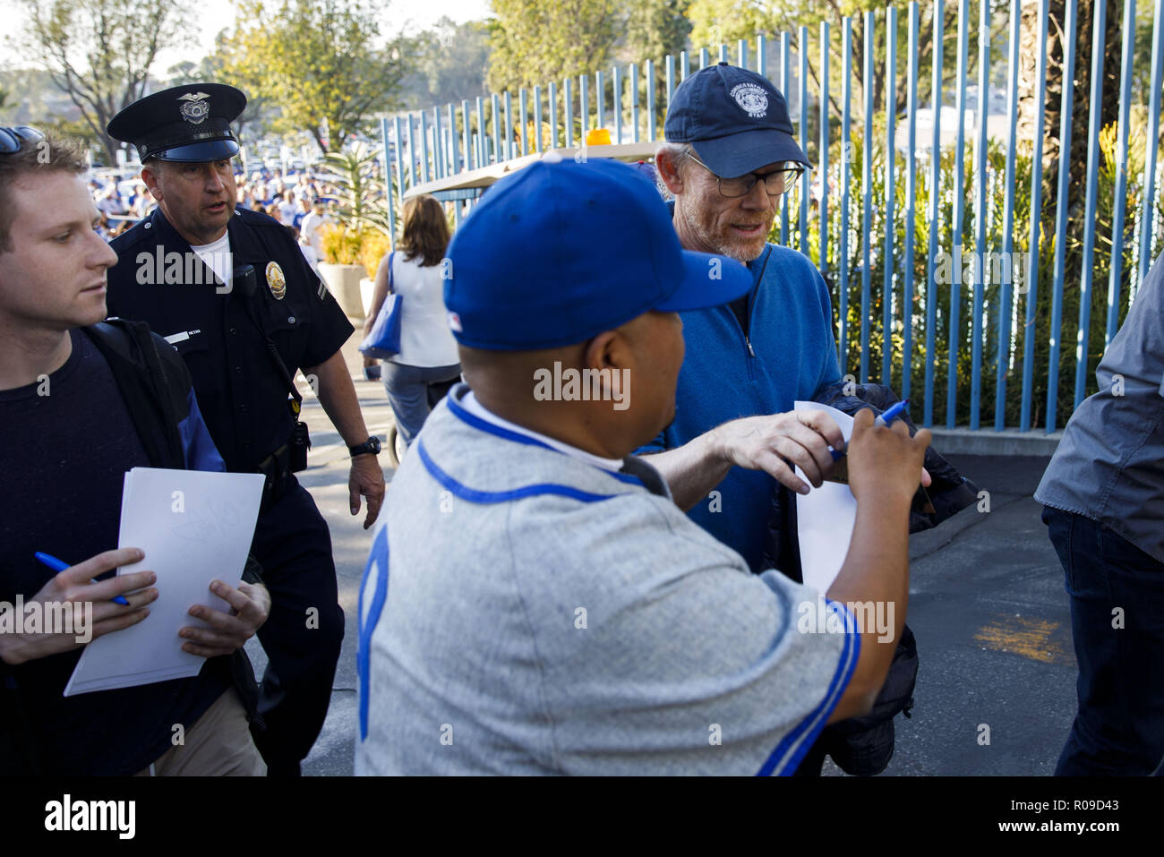Los Angeles, CA, USA. 26th Oct, 2018. Filmmaker Ron Howard signs an autograph as he arrives at Dodger Stadium before Game 3 of the World Series baseball game between the Los Angeles Dodgers and the Boston Red Sox on Friday, October 26, 2018 in Los Angeles, Calif. © 2018 Patrick T. Fallon Credit: Patrick Fallon/ZUMA Wire/Alamy Live News Stock Photo
