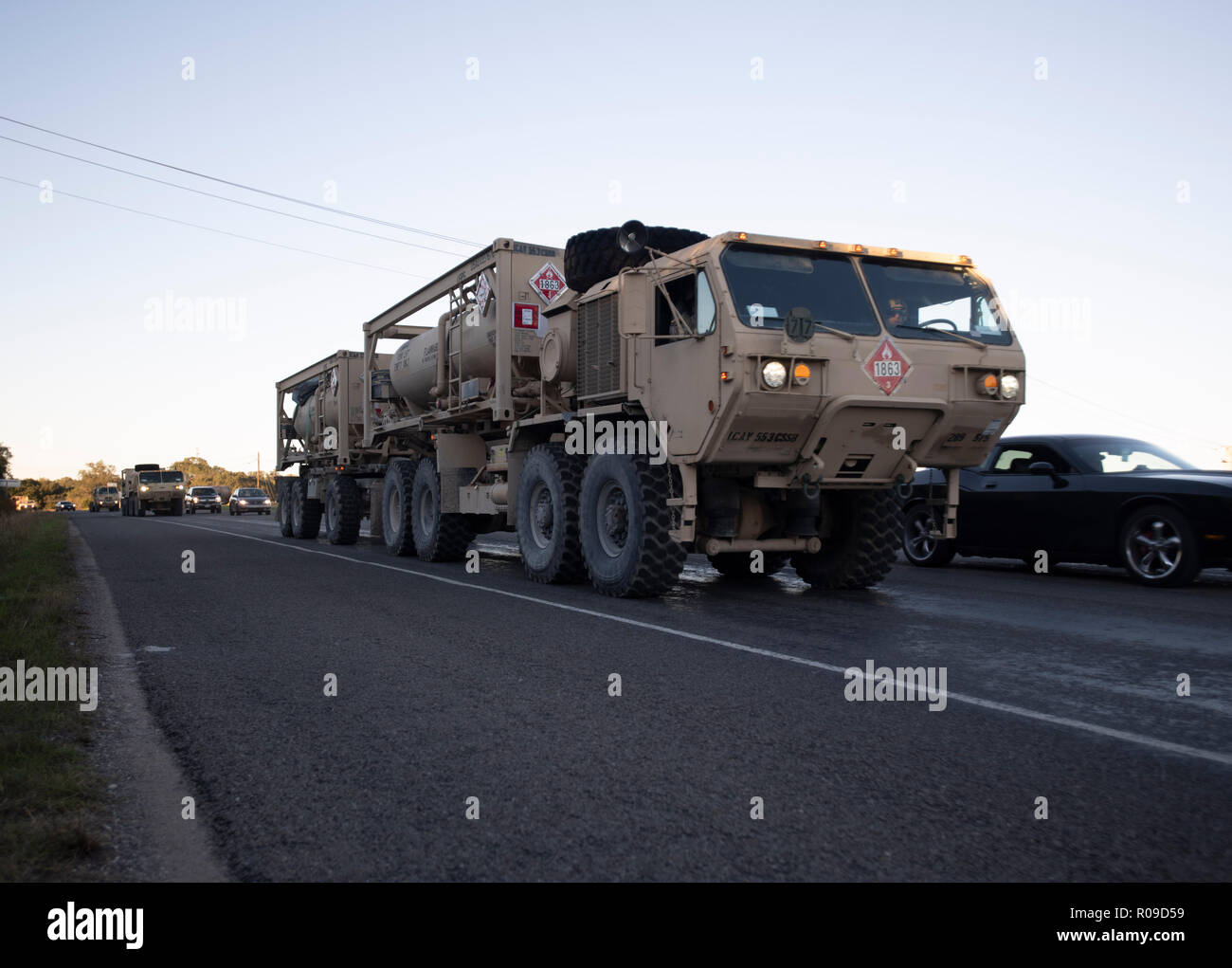 United States Army convoy carries troops and supplies to the U.S.-Mexico border on orders of Pres. Donald Trump. The president sent troops to the border in response to his perception of a group of refugees, fleeing violence and poverty in Honduras and trying to reach the relative safety of the United States, as a national security threat. Stock Photo