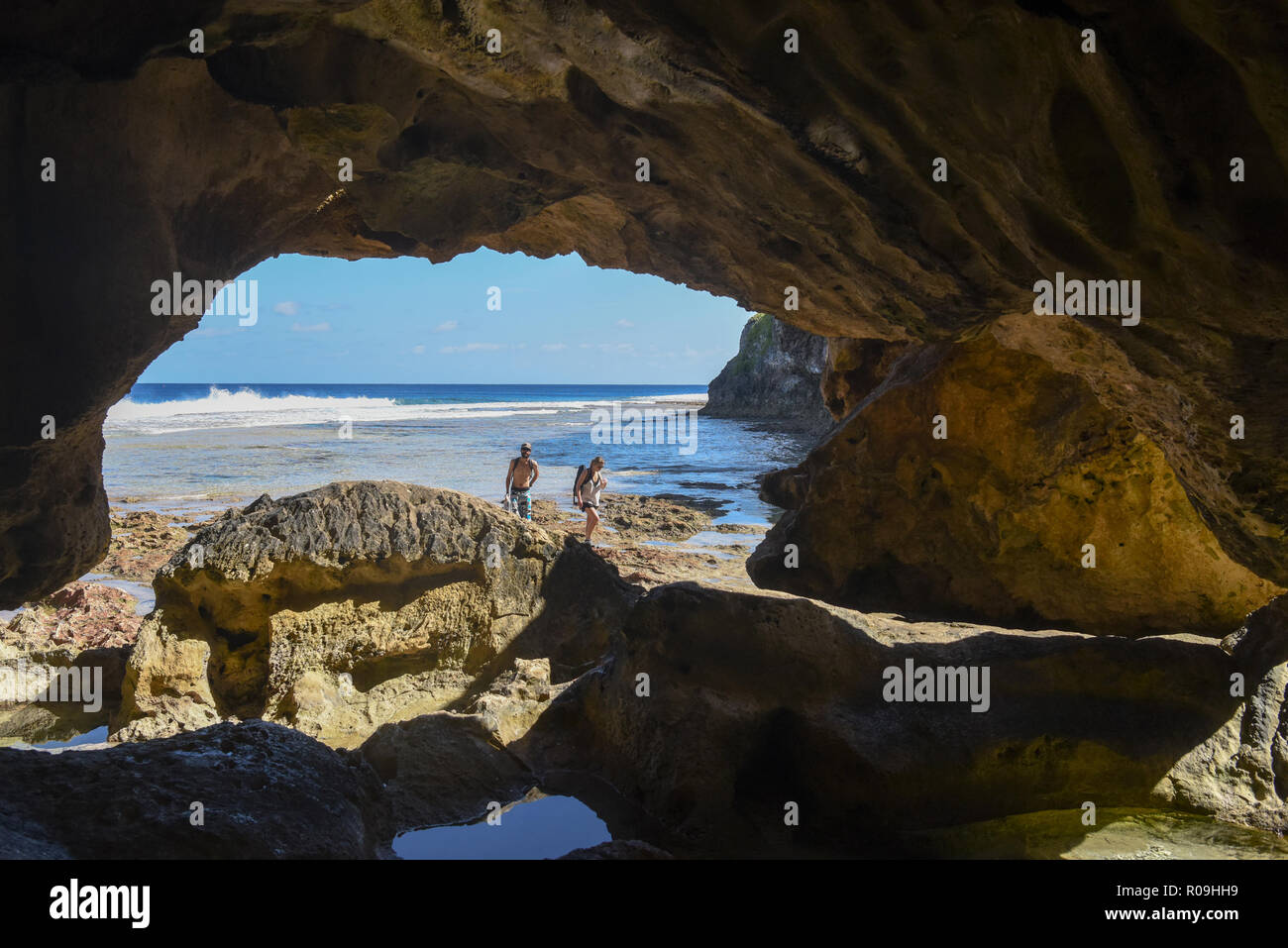 Alofi, Niue. 2nd Nov, 2018. Tourists walk by the Avaiki cave, in Niue, on Nov. 2, 2018. Niue, as referred to 'the Rock', is one of the biggest coral islands on the planet with dramatic cliffs, interesting caves and chasms that are teeming with marine life. Visitors can enjoy snorkelling, diving, and whale watching trips. Credit: Guo Lei/Xinhua/Alamy Live News Stock Photo