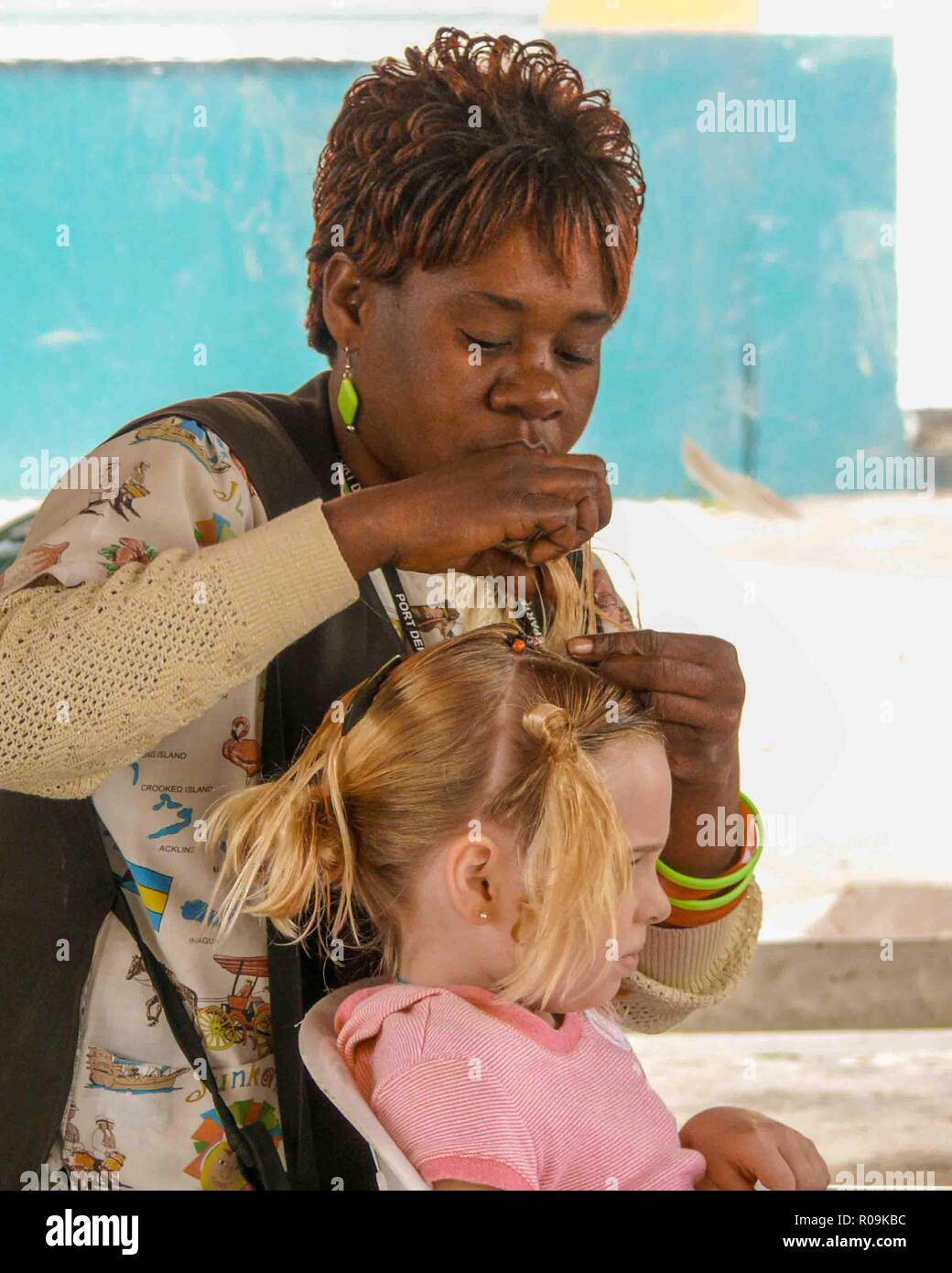 Nassau, New Providence, Bahamas. 16th Jan, 2009. A young tourist has her hair braided in cornrows by a Bahamian woman in Nassau, capital of the Bahamas, a popular cruise-ship destination. Credit: Arnold Drapkin/ZUMA Wire/Alamy Live News Stock Photo