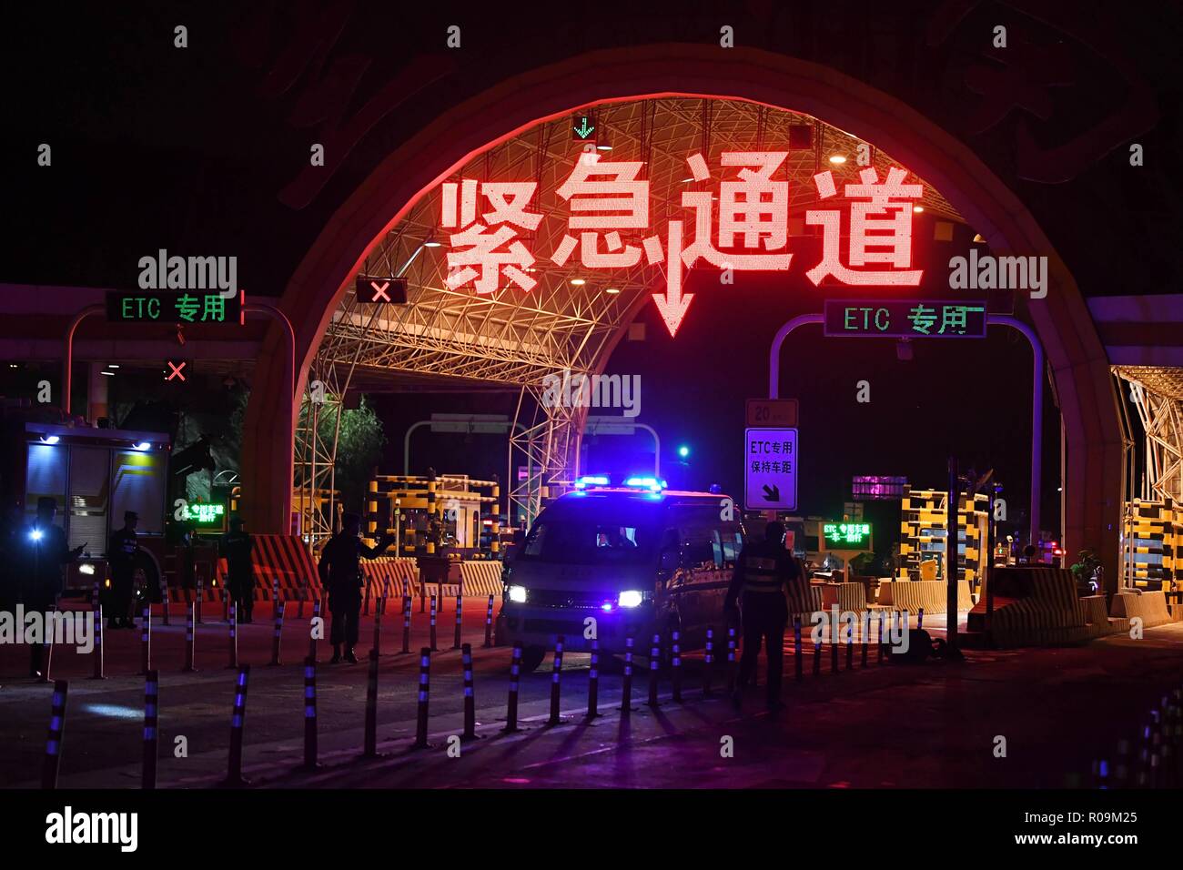 Lanzhou. 3rd Nov, 2018. An ambulance arrives at the site of a traffic accident at Lanzhou south toll station of Lanzhou-Haikou expressway in northwest China's Gansu Province, Nov. 3, 2018. At least 14 people were killed and 27 others injured in a 31-vehicle pile-up on the expressway on Saturday evening, local authorities said. Credit: Chen Bin/Xinhua/Alamy Live News Stock Photo