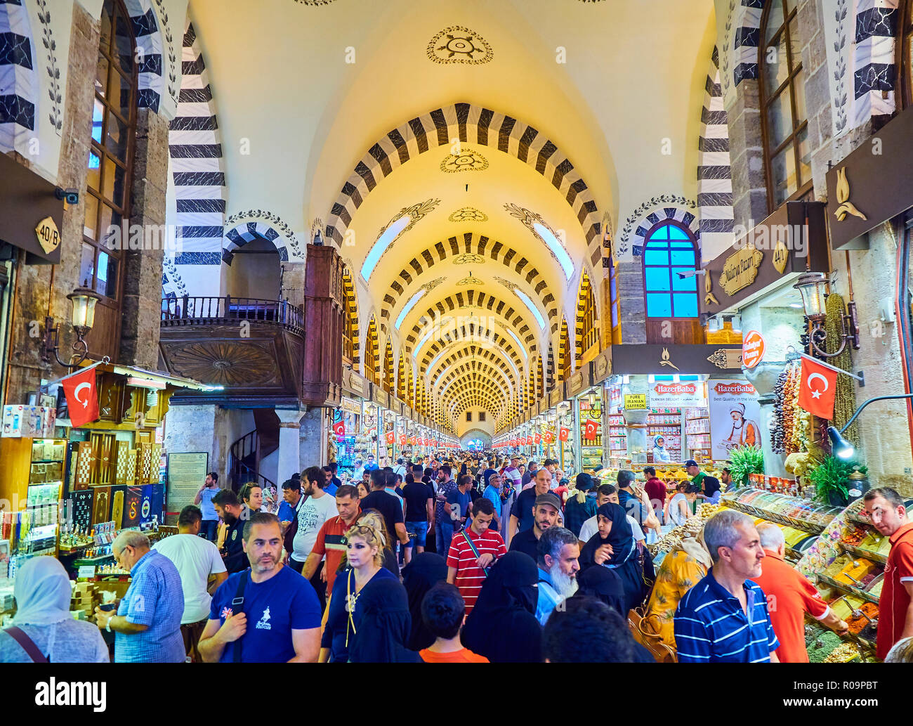 Tourists in Misir Carsisi, the spice bazaar of Eminonu district, Istanbul, Turkey. Stock Photo
