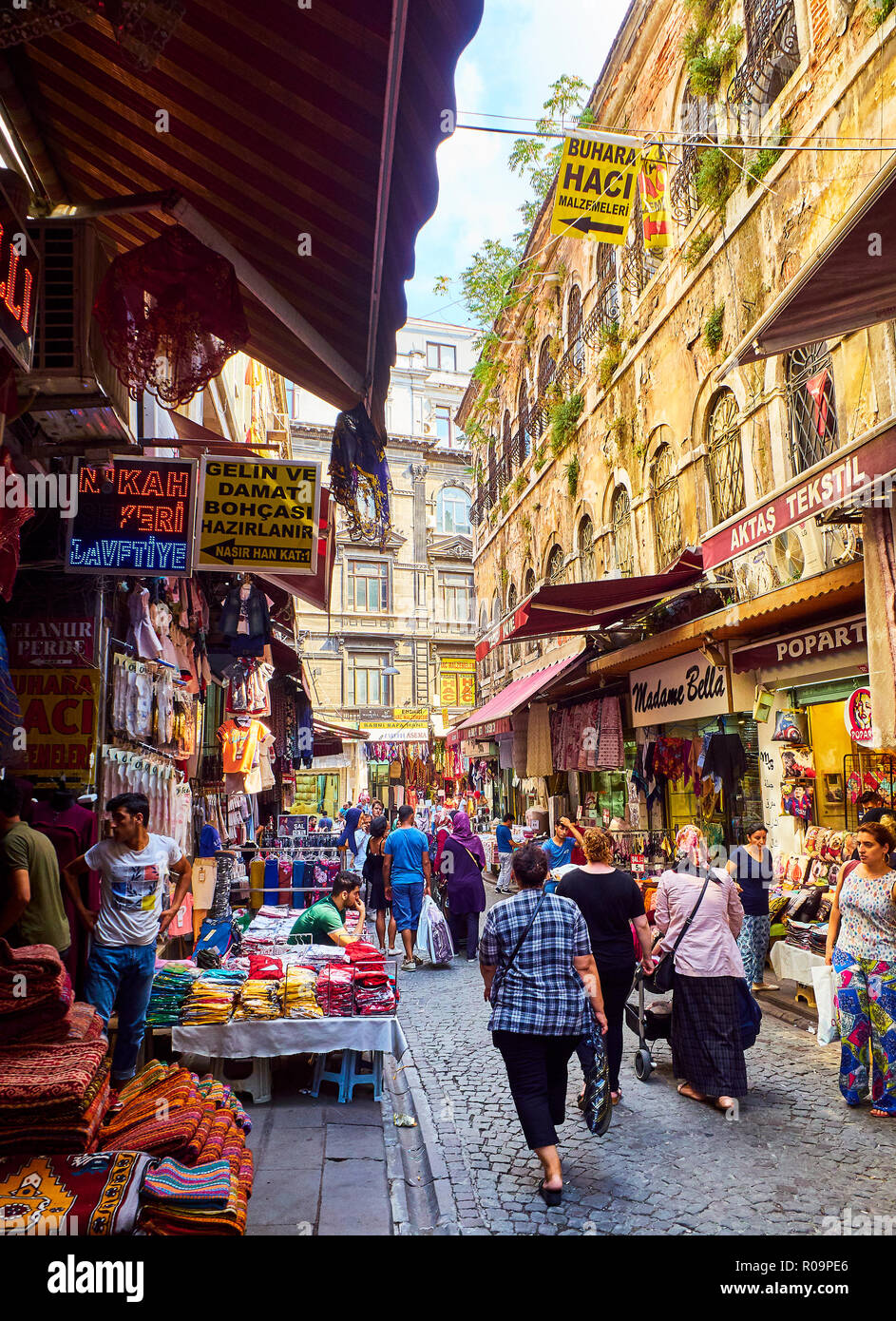 Citizens walking in Fincancilar street, a typical comercial street of Eminonu neighborhood, Fatih district. Istanbul Stock Photo