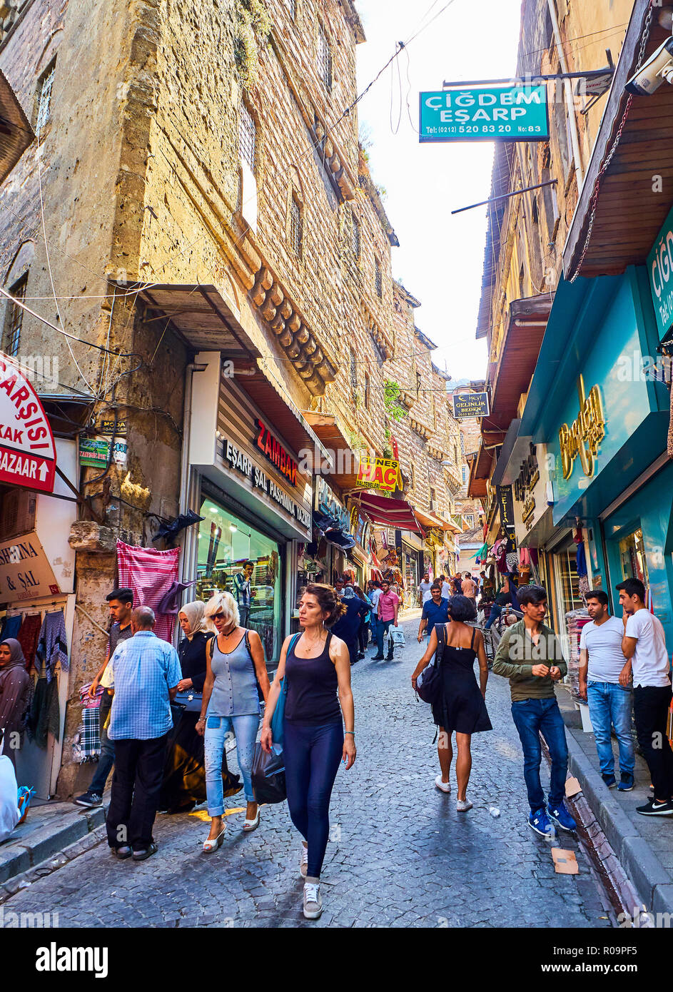 Citizens walking in Cakmakcilar street, a typical commercial street of Eminonu neighborhood, Fatih district. Istanbul. Turkey. Stock Photo
