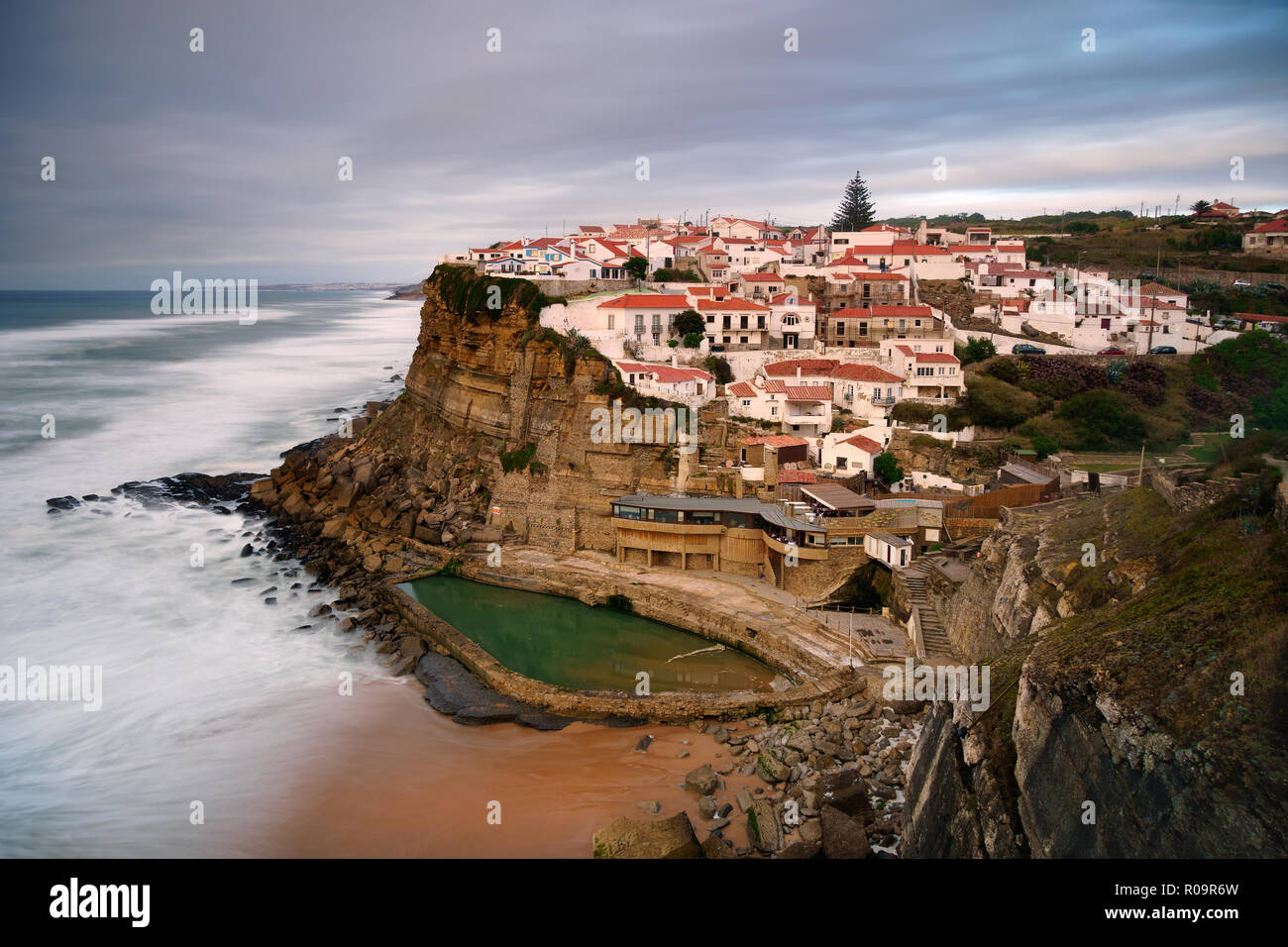 View of the Picturesque village Azenhas do Mar, on the edge of a cliff with a beach below. Landmark near Sintra, Lisbon, Portugal, Europe. landscape. Stock Photo
