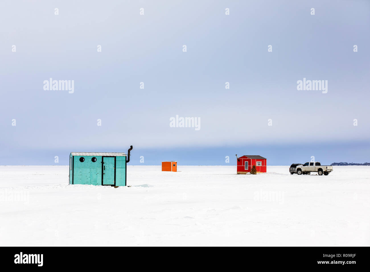 Ice fishing shacks on Lake Winnipeg, Manitoba, Canada. Stock Photo