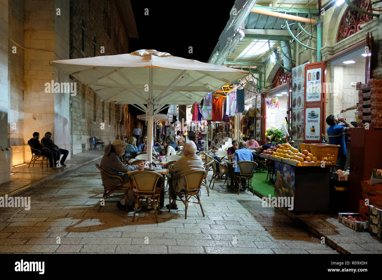 Tourists sitting in coffee shop in Muristan street in the Christian
