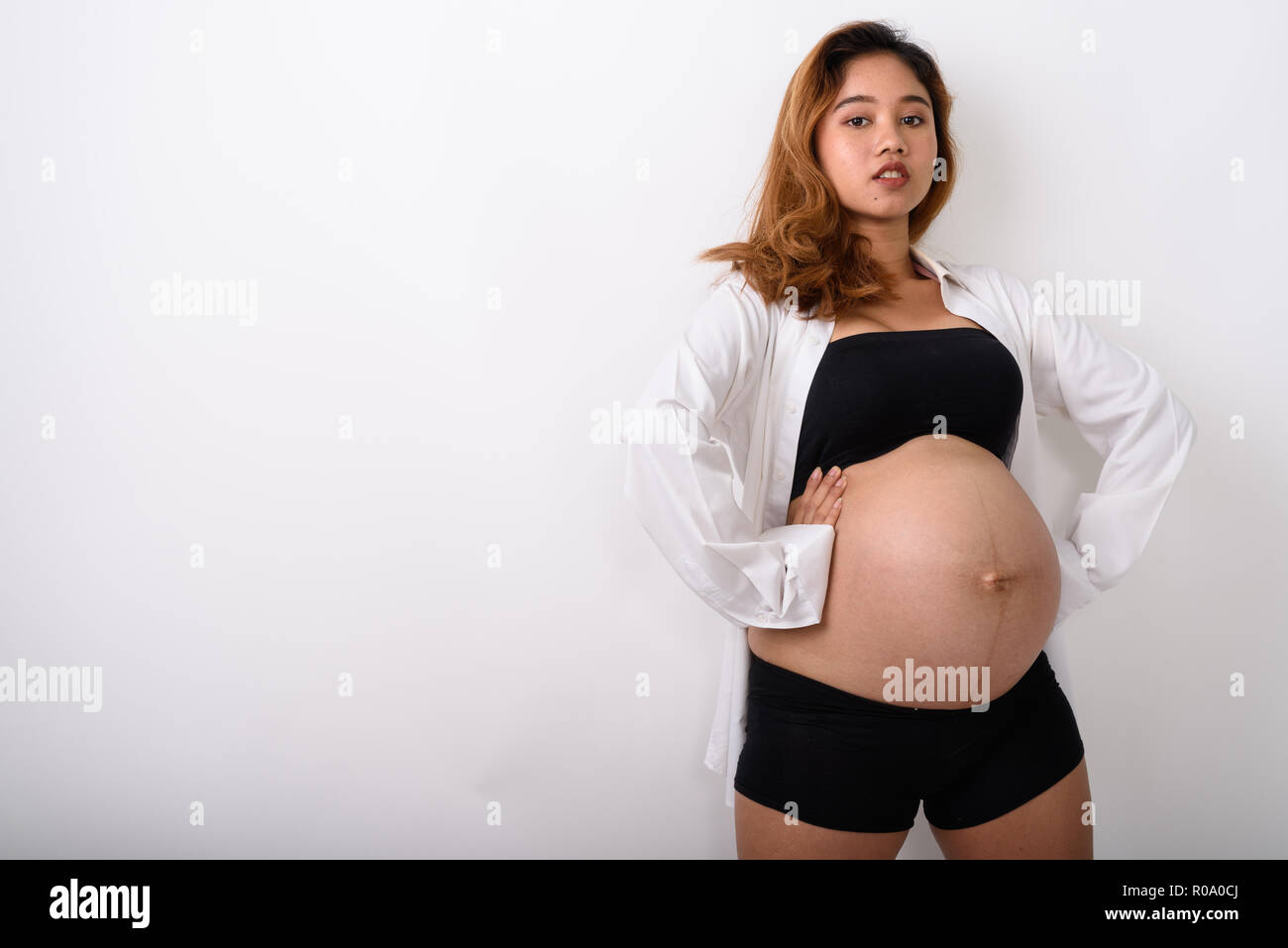 Portrait of beautiful young pregnant Asian woman Stock Photo