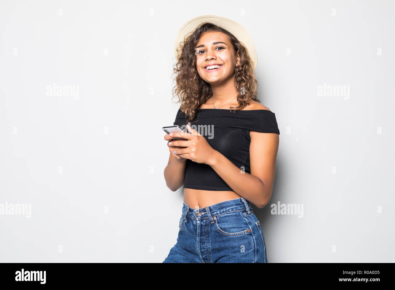 Cheerful Nice Cute Curly Mulatto Girl With Wavy Hair In Casual