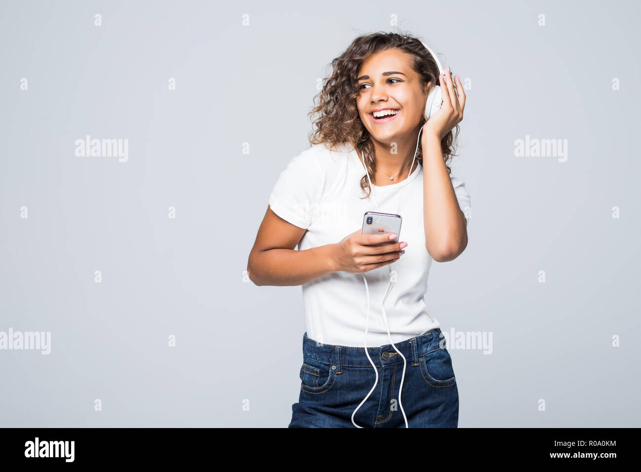 Excited woman dancing over white hi-res stock photography and images ...