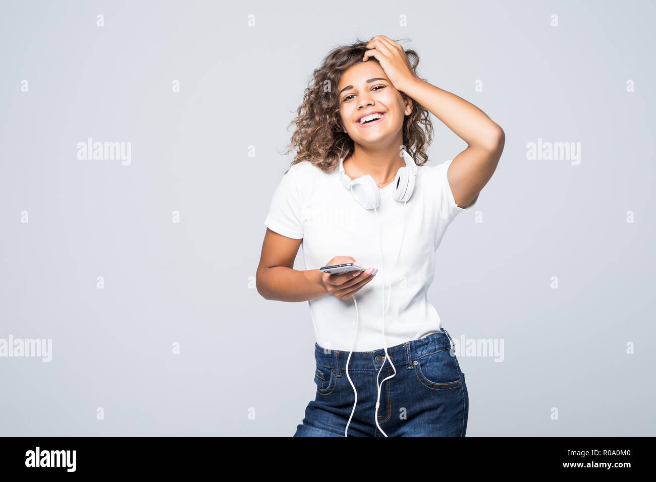 Excited woman dancing over white hi-res stock photography and images ...