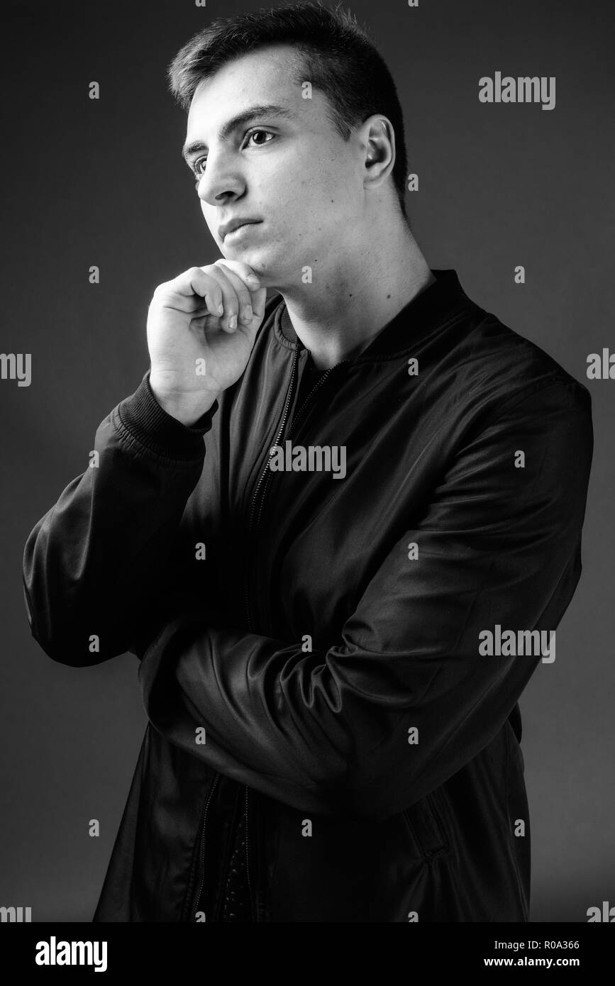 Studio Shot Of Young Handsome Man In Black And White Stock Photo Alamy
