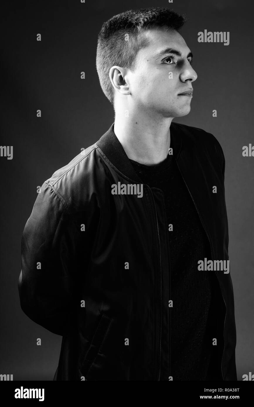 Studio shot of young handsome man in black and white Stock Photo - Alamy