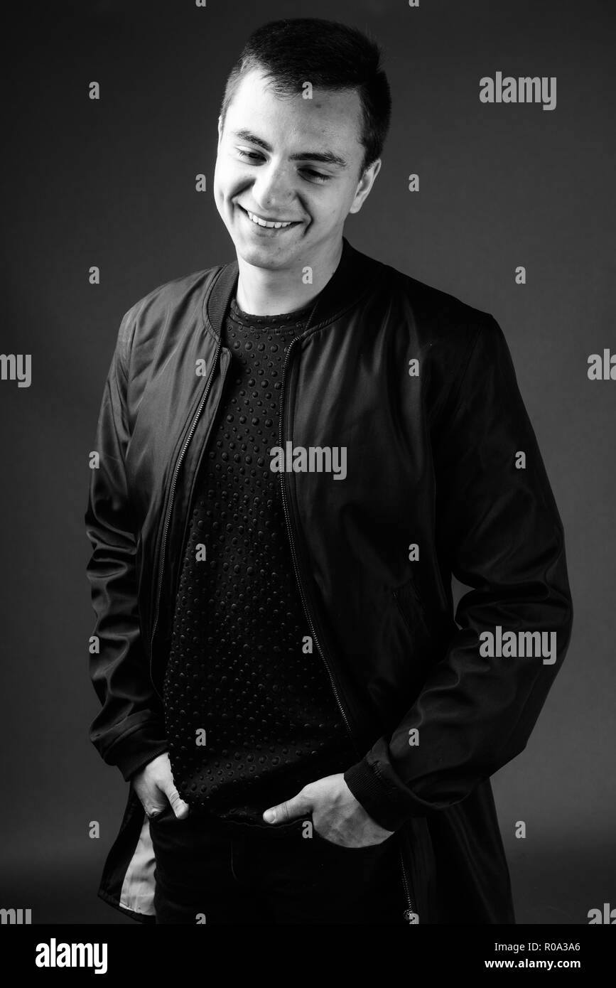 Studio shot of young handsome man in black and white Stock Photo - Alamy