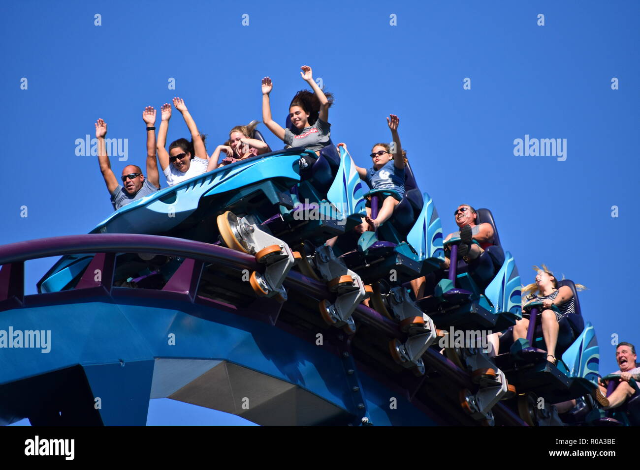 Orlando, Florida; October 10, 2018  People having fun and raising arms in Rollercoaster at International Drive area Stock Photo