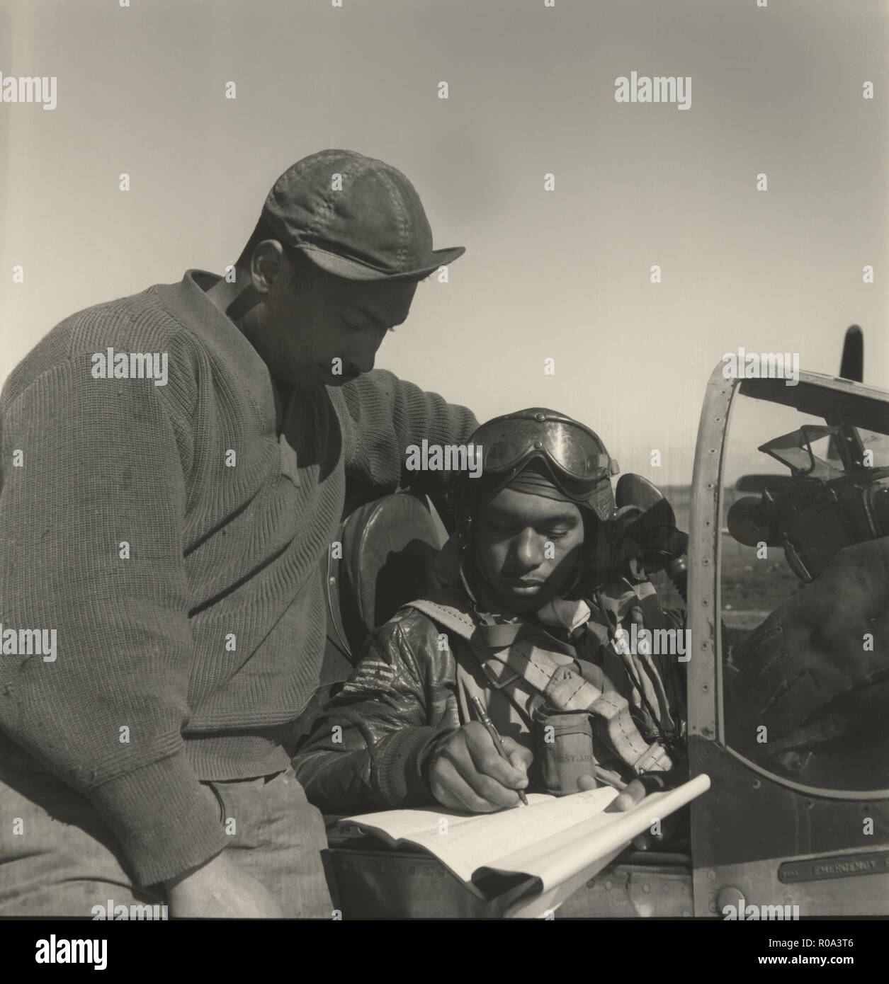 Pilot from 332nd Fighter Group Signing Form One Book, Indicating any Discrepancies of Aircraft, Prior to Take-off, Ramitelli, Italy, Toni Frissell, March 1945 Stock Photo