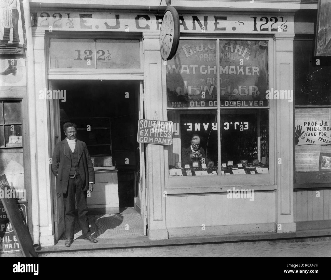 Man Working in Window and Man Standing in Doorway, E.J. Crane
