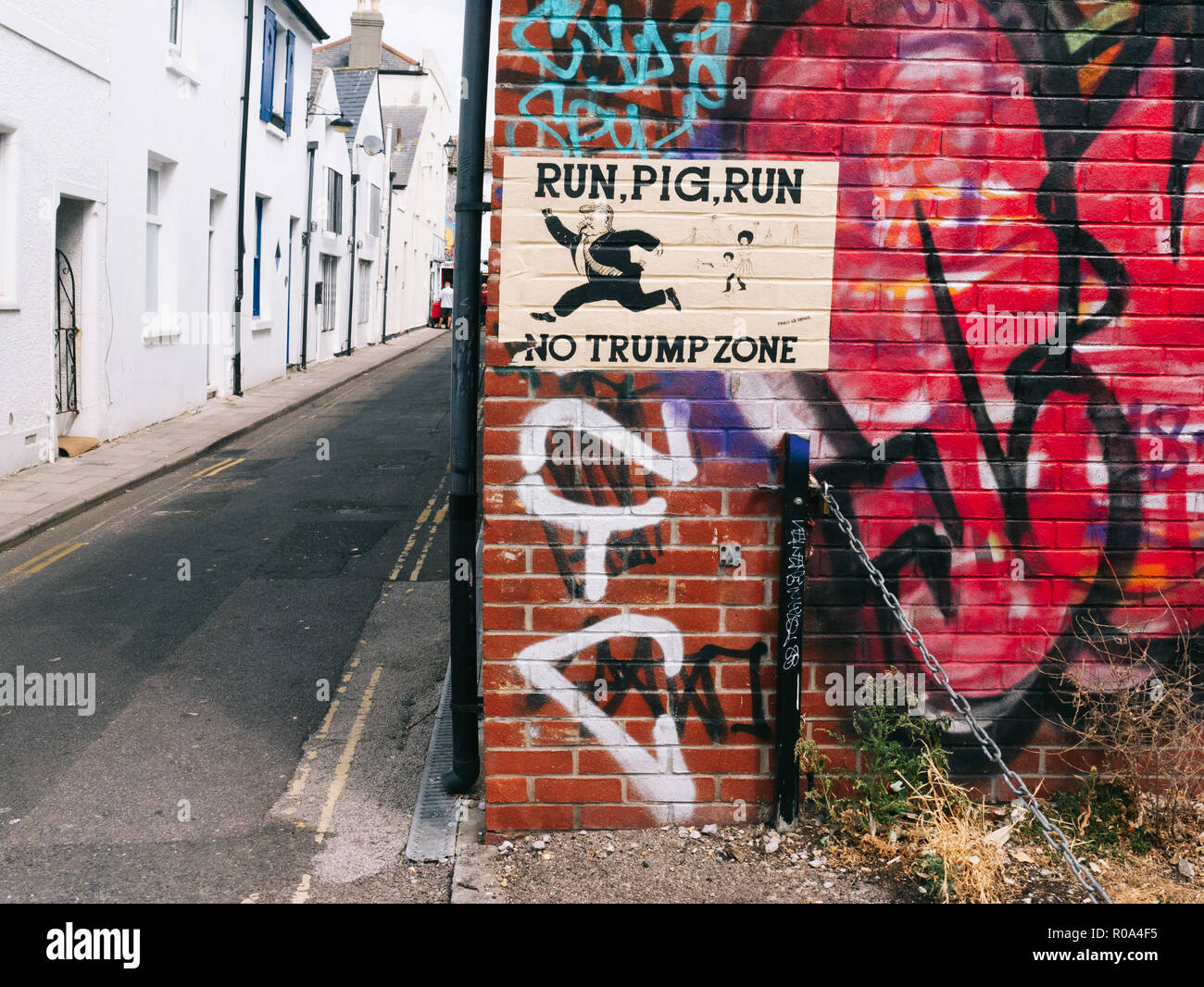 Poster against Trump on Brighton's wall Stock Photo