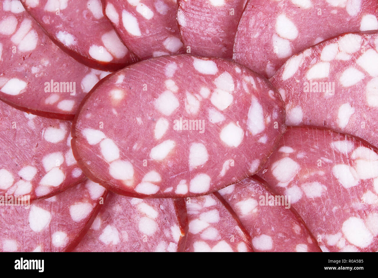 Salami background with many sliced pieces of salami Stock Photo Alamy