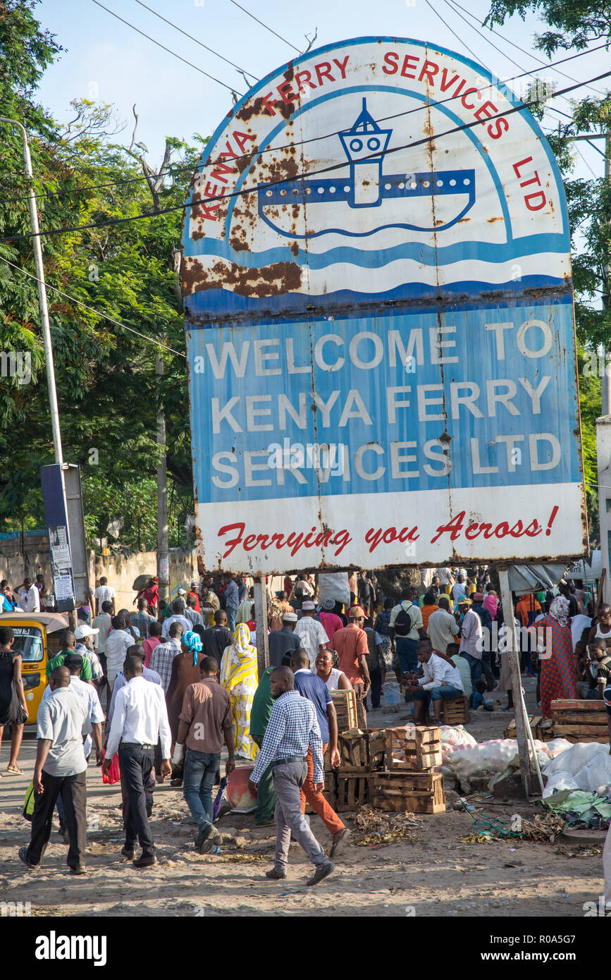 many people walking towards ferry at rushhour in Mombasa, Kenya Stock Photo