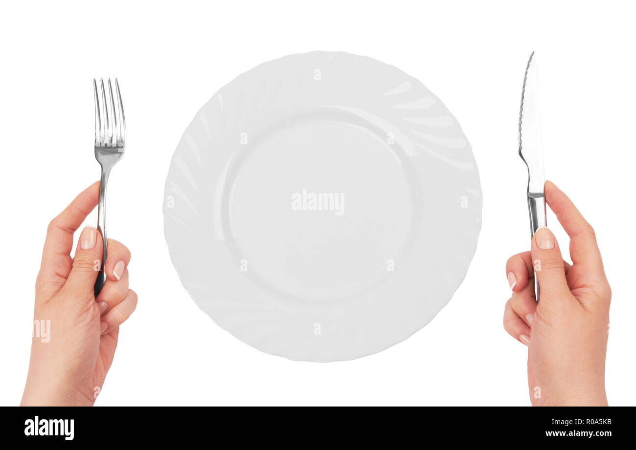 Hands fork knife in plate hi-res stock photography and images - Alamy