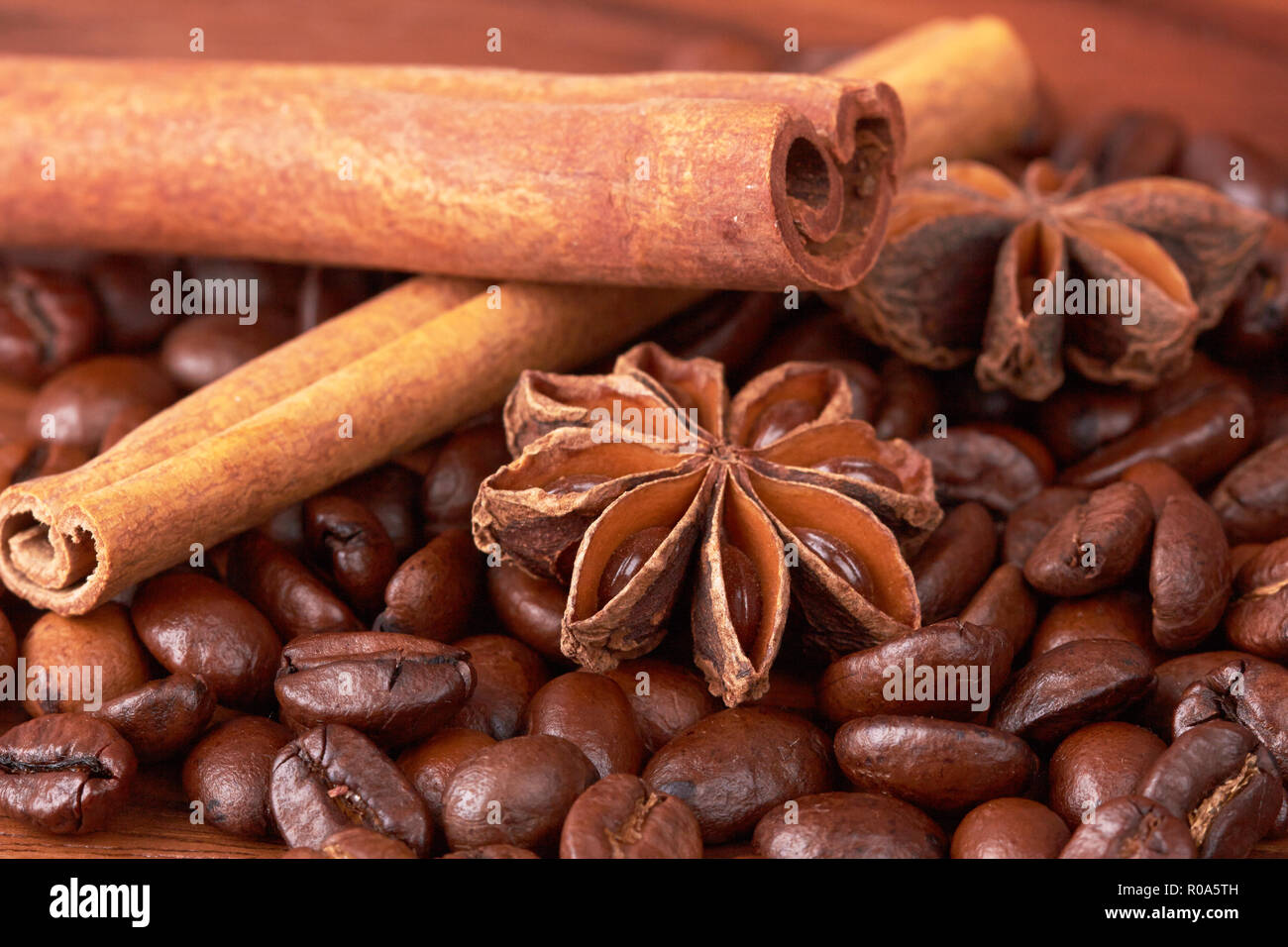 Coffee beans and cinnamon sticks closeup Stock Photo Alamy