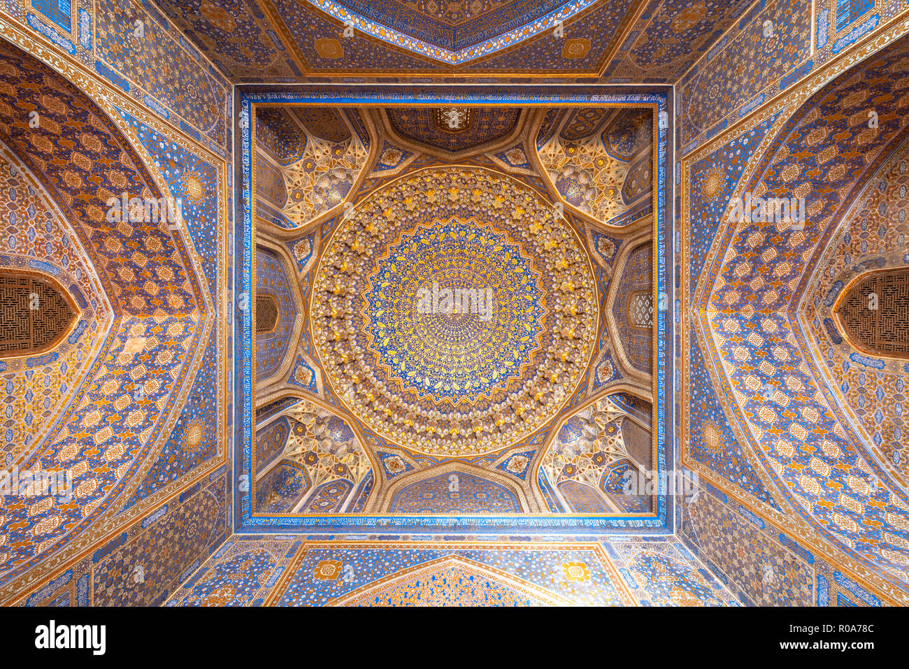 ceiling of Tillya Kori Mosque, Registan complex in Samarkand, Uzbekistan – one of the UNESCO world heritage sites Stock Photo