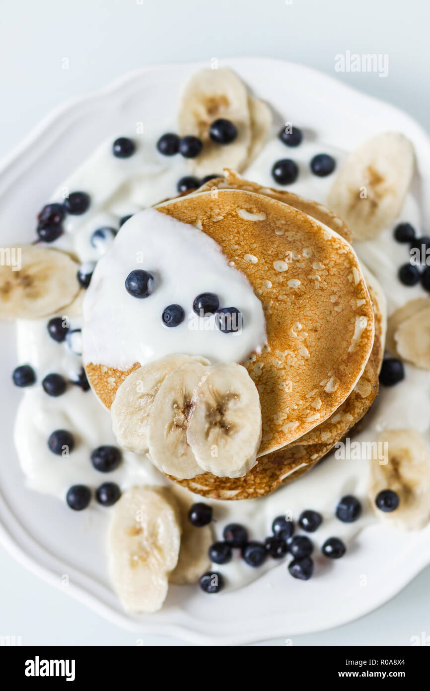 Homemade Pancakes With Banana Blueberries And Sour Cream Stock Photo Alamy