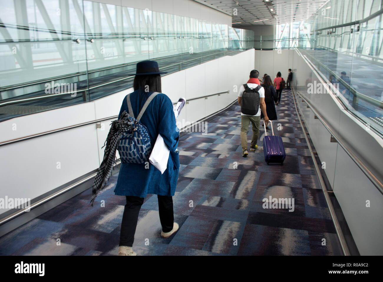 Travelers thai woman walking in terminal go to bus station at Hong Kong ...