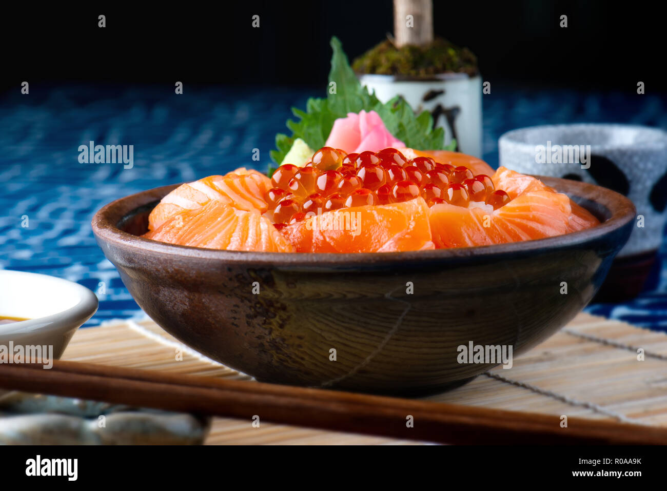 Salmon sashimi and salmon roe with rice bowl or donburi in Japanese