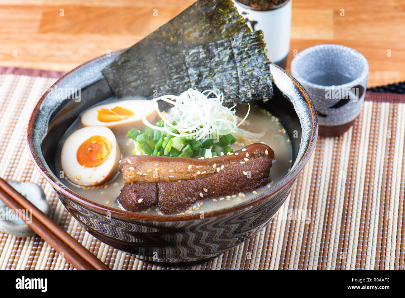 Japanese style noodle tonkotsu ramen set to serve Stock Photo Alamy