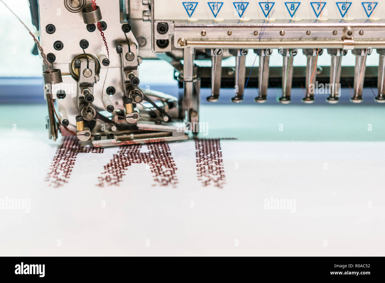 Computerized embroidery machines. sewing machine on blurred background