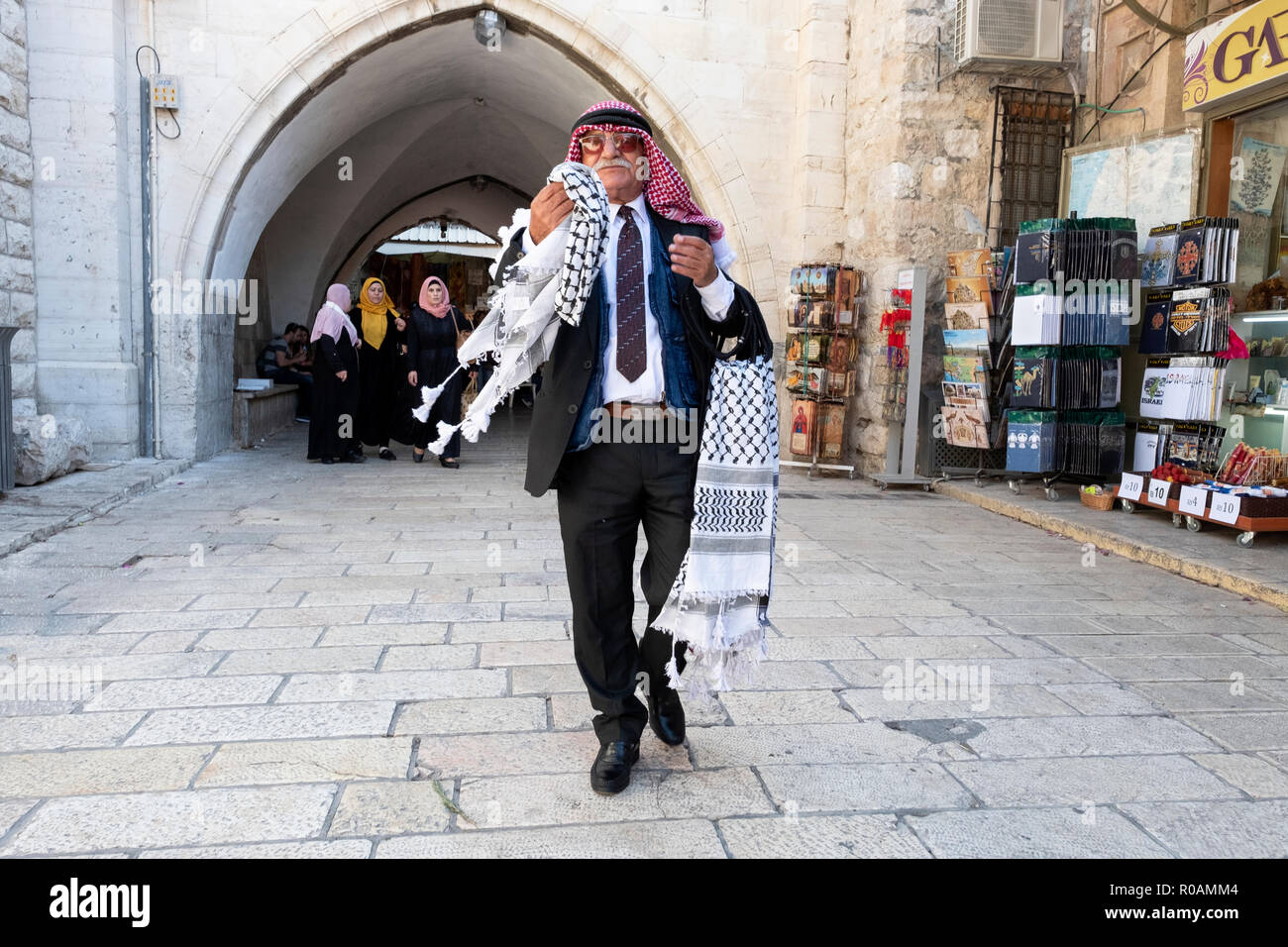 An older Arab man peddling arabic scarves to tourists in the Old City,  Jerusalem, Israel Stock Photo - Alamy