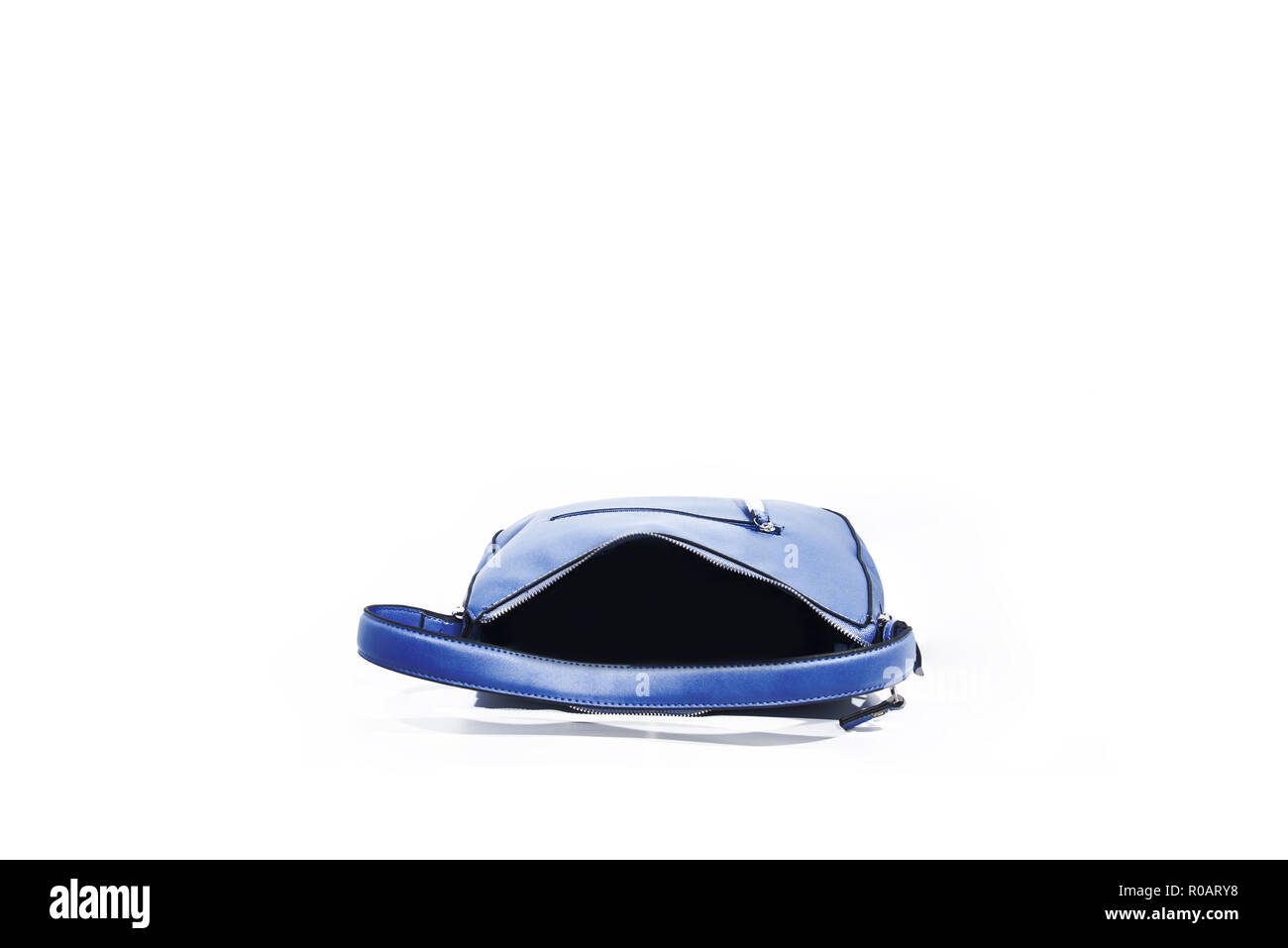 Empty blue ladies handbag isolated on white background. Stock Photo