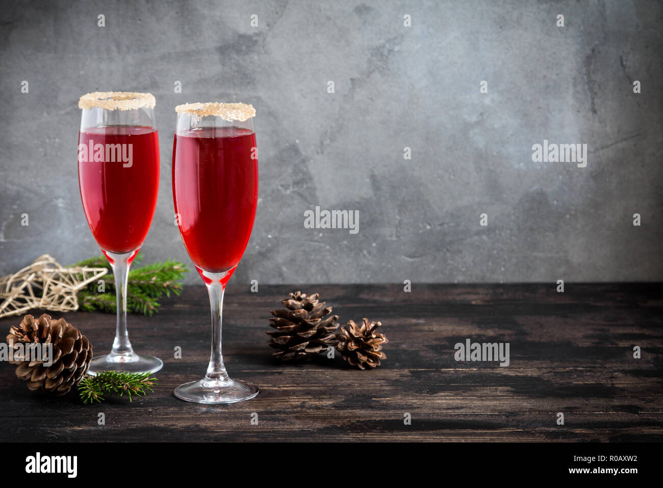 Mimosa festive drink for Christmas - champagne red cocktail Mimosa (mocktail) with cranberry for Christmas party, copy space Stock Photo