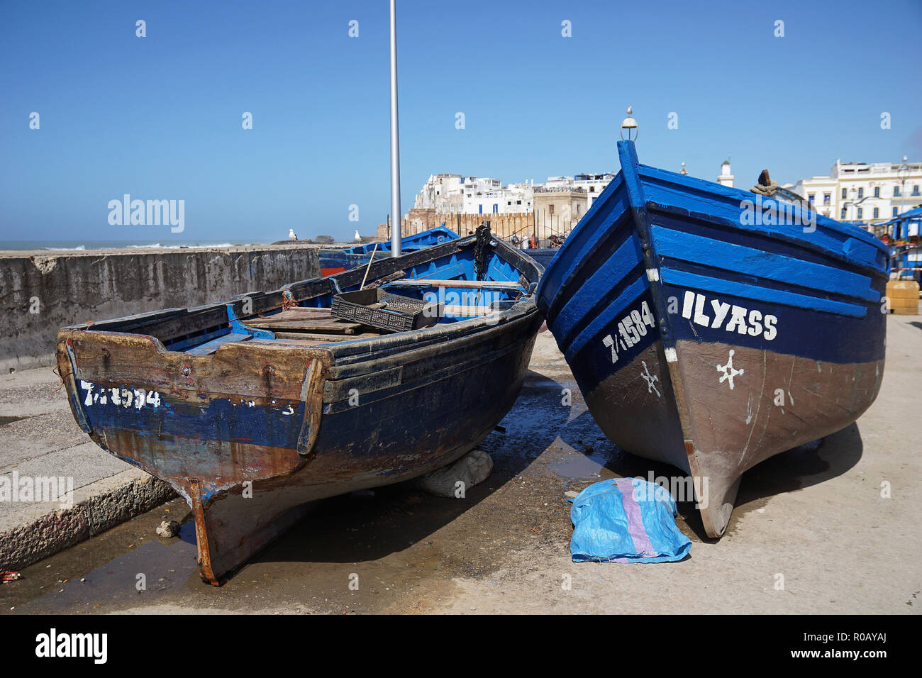 Traditional blue wooden fishing boats  in Essaouira harbour, Morocco, Africa Stock Photo