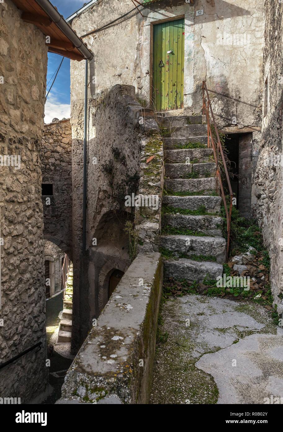 Narrow alley between old stone houses, Roccacasale Abruzzo Stock Photo