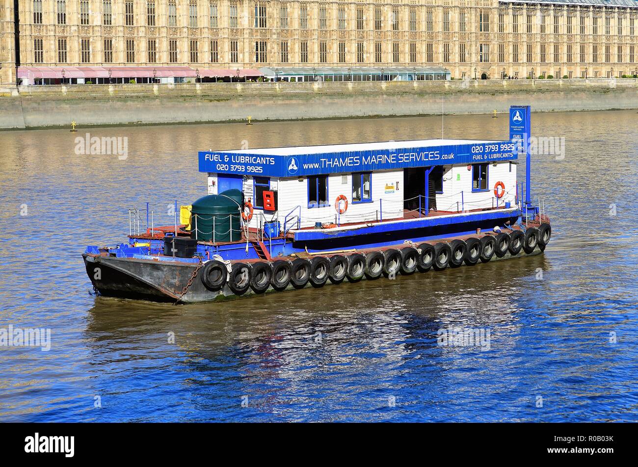 London, England, United Kingdom. Boat on the River Thames provides a foreground to the Houses of Parliament. Stock Photo