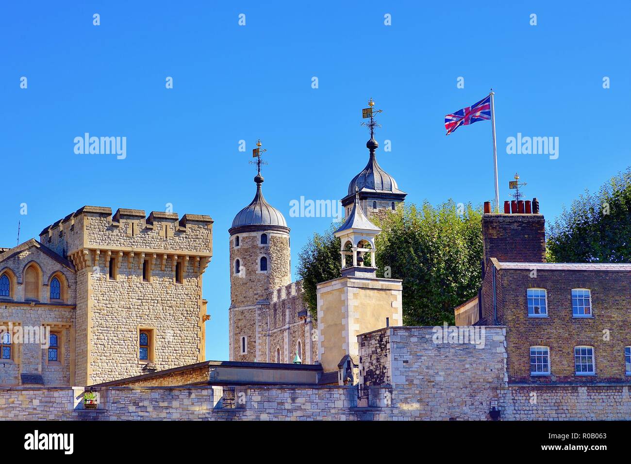 London, England, United Kingdom. White Tower within the Inner Ward of the Tower of London partially obscured by outer region structures. Stock Photo