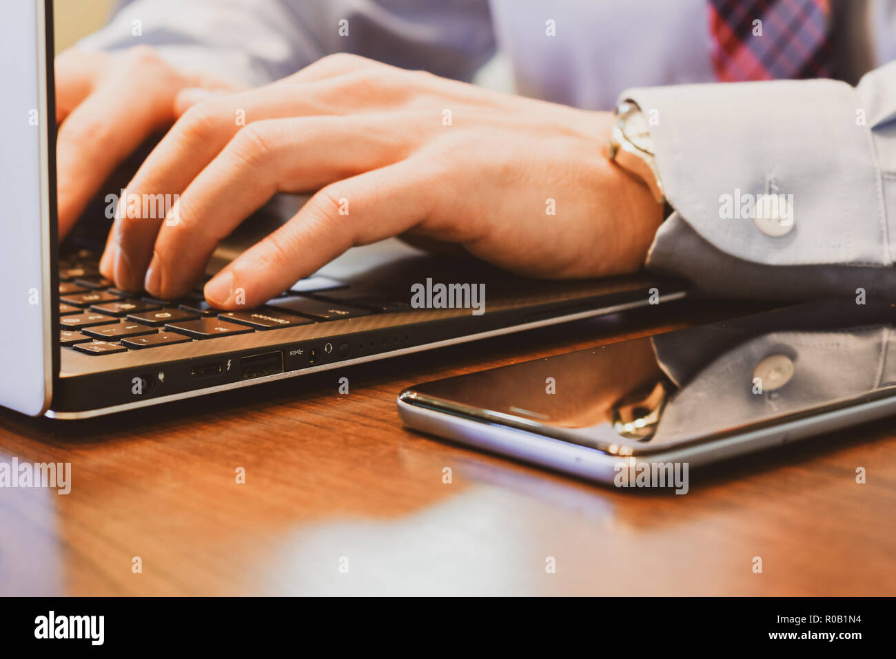 Typing on a computer Stock Photo